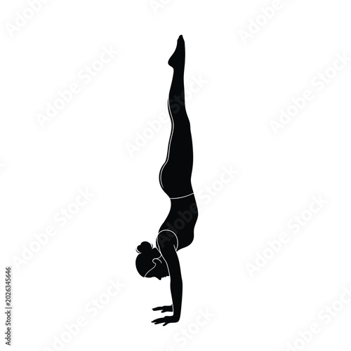 Photos Woman doing handstand exercise.