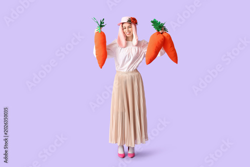 Stylish woman with bunny ea...