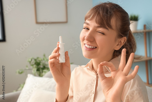 Ill young woman with nasal ...
