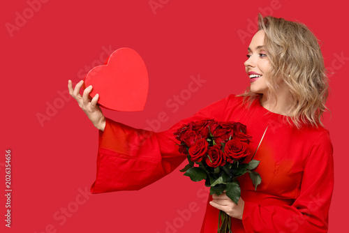 Young woman with bouquet of...