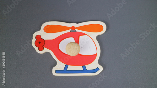 Bild auf Leinwand Cartoon toy helicopter decoration on gray background