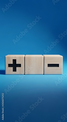 Three wooden blocks with plus, blank, and minus symbols