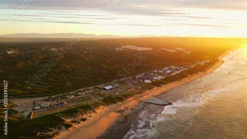 Witsand eastward aerial sunrise view as waves crash onto shore, Garden Route