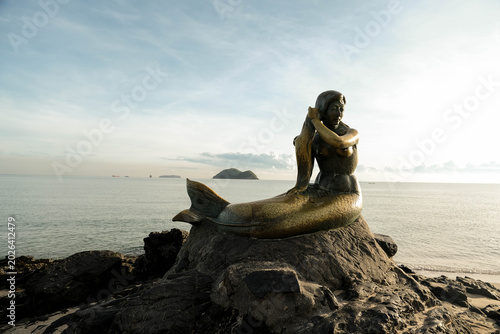 Close up of the legendary Golden Mermaid statue at Samila Beach during early morning