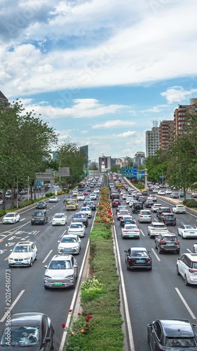 Blue skies and white clouds over Beijing's East Third Ring Road, and the flow of cars.