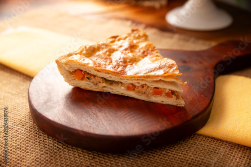 Tableau sur toile Tuna Pie, a savory tart filled with canned tuna cooked and seasoned with various ingredients, in Mexico it is called Pay de Atun or Empanada Gallega, very popular recipe during the Lenten season