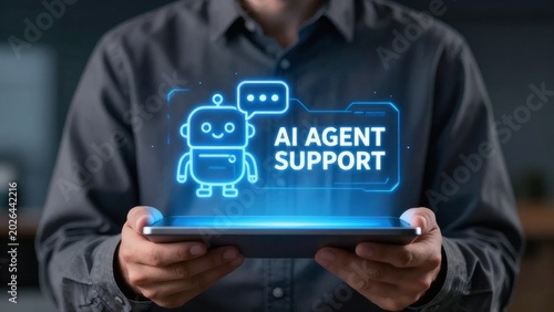 Professional holding a tablet displaying a bright glowing holographic icon representing modern artificial intelligence agent support