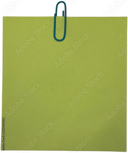 Blue paperclip attached to green paper