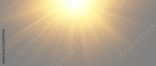 Bright sunburst with golden sun rays shining from the top center