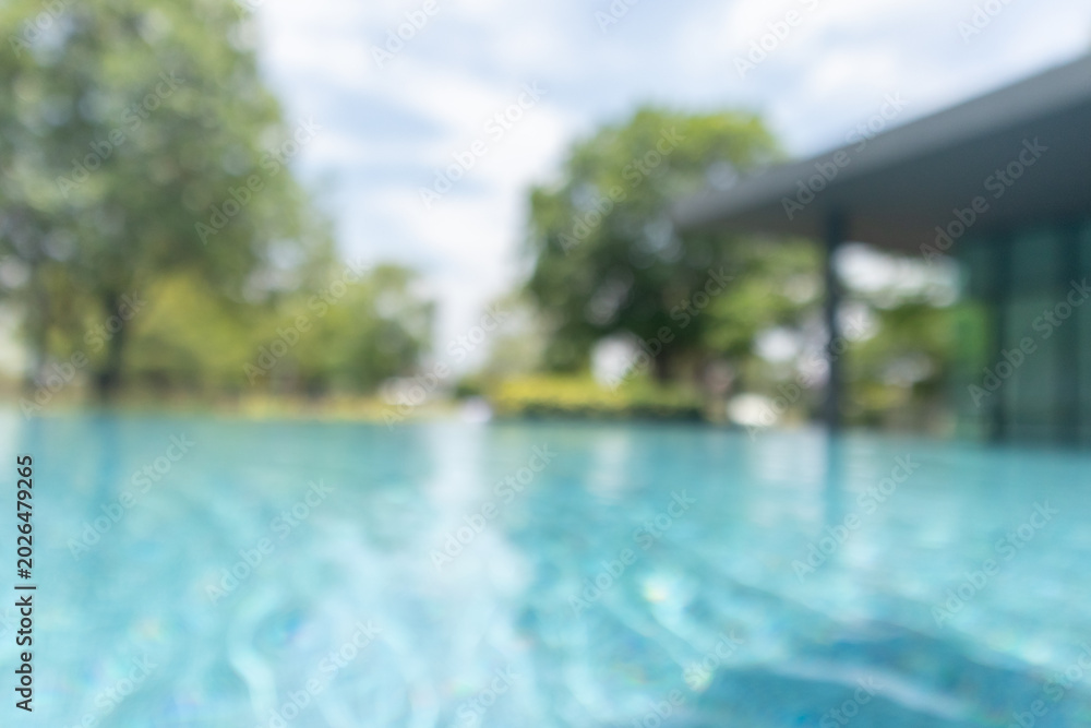 Fototapeta premium Abstract blur outdoor swimming pool in tropical resort hotel summer background