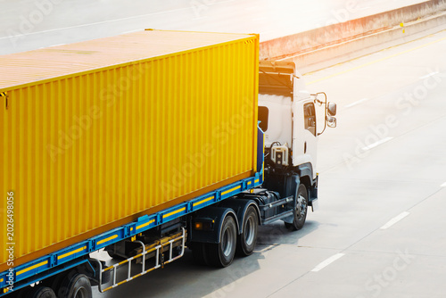 Semi Trailer Truck Driving on the Road. Shipping Truck, Cargo Container. Economical Transportation Business. Economy Business Transport on Road. Trucking. Freight Transportation Logistics.	