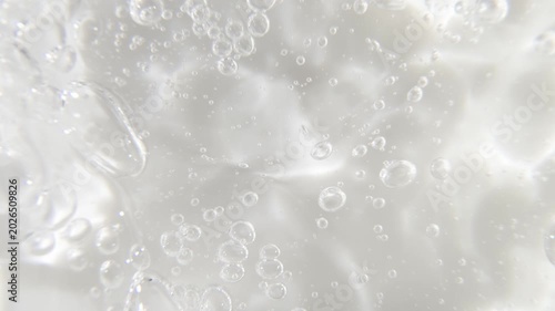 Cosmetics serum gel background, transparent cream texture, facial mask treatment