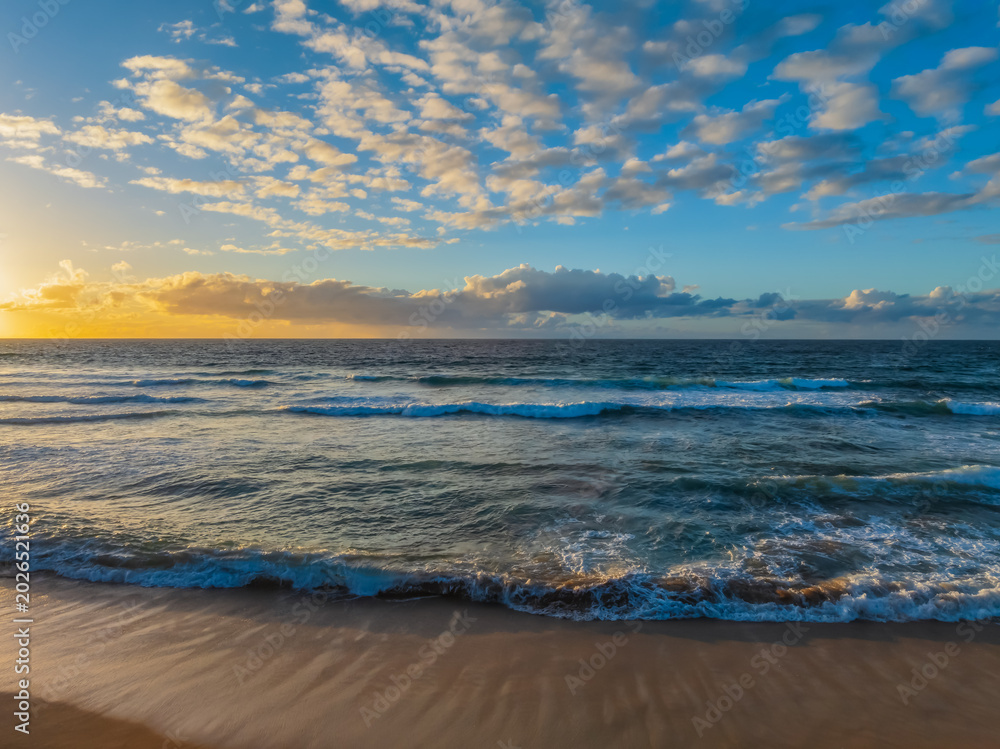 Fototapeta premium Sunrise at the Seaside with a Mackeral Sky