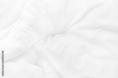 Bild auf Leinwand Close up top view of white bedding sheet and wrinkle messy blanket in bedroom after wake up in the morning
