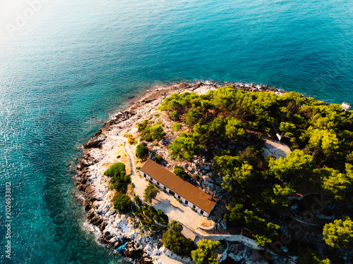 Aerial view of the historic Hvar town and overlooking the harbor and Adriatic sea, Hvar island, Dalmatia, Croatia.