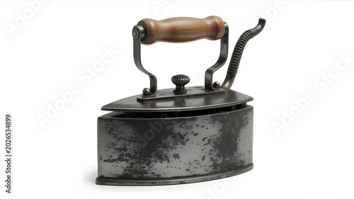 Vintage electric iron with wooden handle, a classic household appliance with a rustic charm, showcasing historical domestic technology
