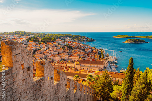 Hvar town and Pakleni Islands viewed from the medieval Spanish Fortress, golden hour over the Adriatic sea, Croatia.