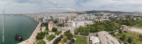 Wide aerial panorama of the White Tower and waterfront in Thessaloniki, Greece