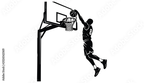 vector silhouette of a male basketball player slam dunk, scoring the ball to the net