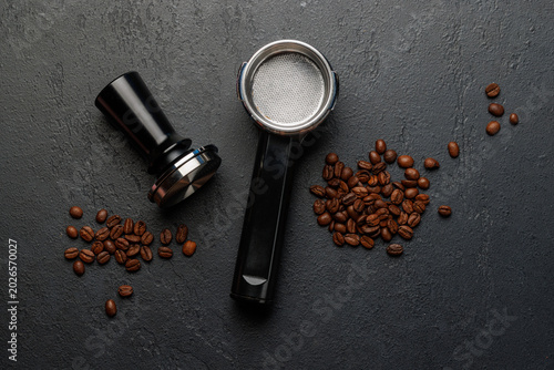 Εκτύπωση καμβά Coffee tamper and portafilter with roasted coffee beans on dark background