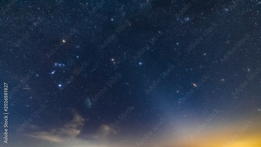 Fototapeta premium Orion constellation and Milky Way stars on a dark countryside skies.