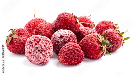 A close-up, studio shot of a pile of strawberries. Some are fresh, others partially frosted, and all isolated on white