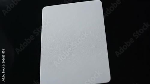 White card with smoke on black background symbolizing dynamic movement and artistic expression