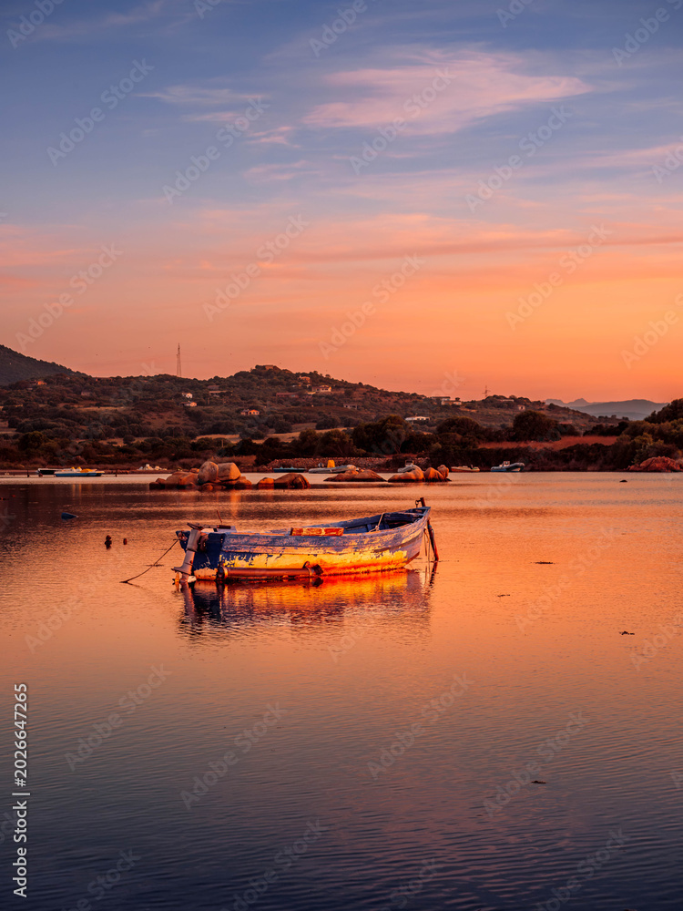 Fototapeta premium Fishermen''s boats in a bay in the sunset