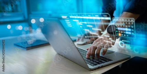 Foto Project manager or businessman using stylus on laptop with hologram Gantt chart schedule interface