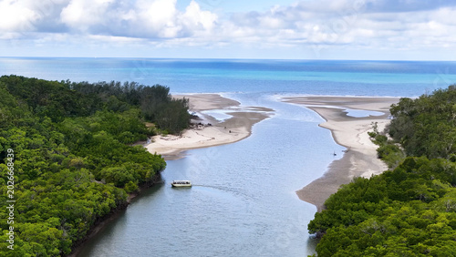 Canvastavla Aerial View of a Boat Navigating a River Mouth and Mangrove Coastline