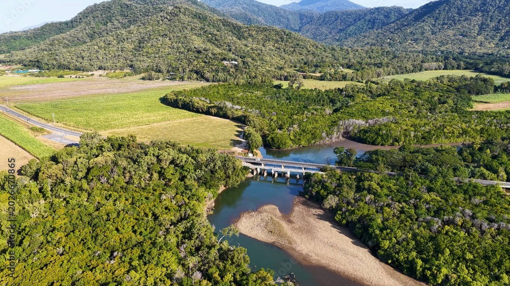 Fototapeta premium Aerial View of a Bridge Over a Tropical River in Queensland Australia