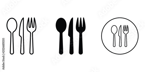 Black and white cutlery utensils on plate, spoon, fork
