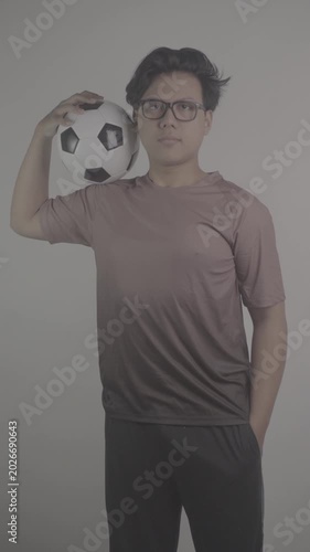 Southeast Asian person is carrying soccer ball on his shoulders S-Log3, S-Gamut3.Cine