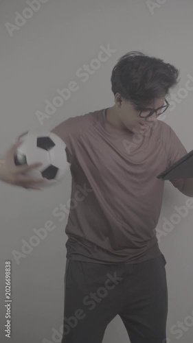 Southeast Asians watch football on their tablets, then get frustrated and annoyed when the opposing team scores goal S-Log3, S-Gamut3.Cine