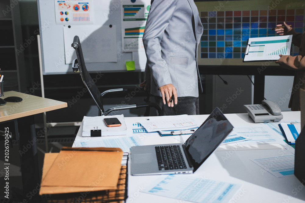 Fototapeta premium Overwhelmed woman working at messy office desk, closeup