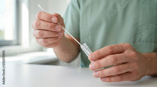 Test tube virus swab sample lab healthcare clinical hands medical worker holding swab above test tube during. Disease infection pandemic epidemic. scientist laboratory research, diagnostic sample