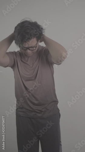 Southeast Asian person wearing brown jersey was so disappointed that he held his forehead with both hands S-Log3, S-Gamut3.Cine