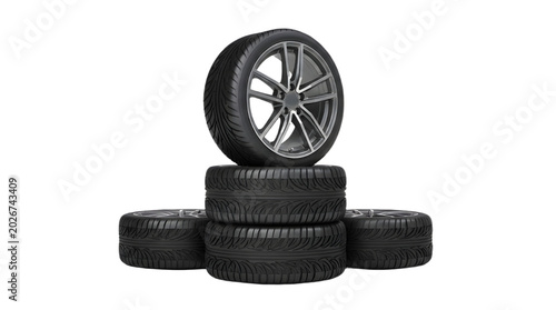 Stack of Four Black Car Tires with One Modern Alloy Wheel on Top Product Shot