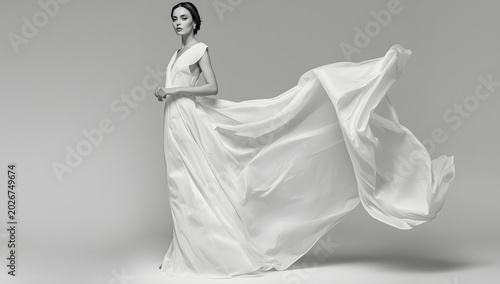 Woman White Dress, Wedding Fashion Model in Long Silk Bride Gown, Waving Flying Fabric, Cloth Fluttering on Wind