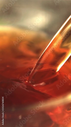 Super slow motion black tea is poured into the cup. Macro background.Filmed on a high-speed camera at 1000 fps.