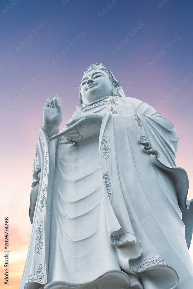 Fototapeta premium Lady Buddha statue on the sunrise. Danang Vietnam.