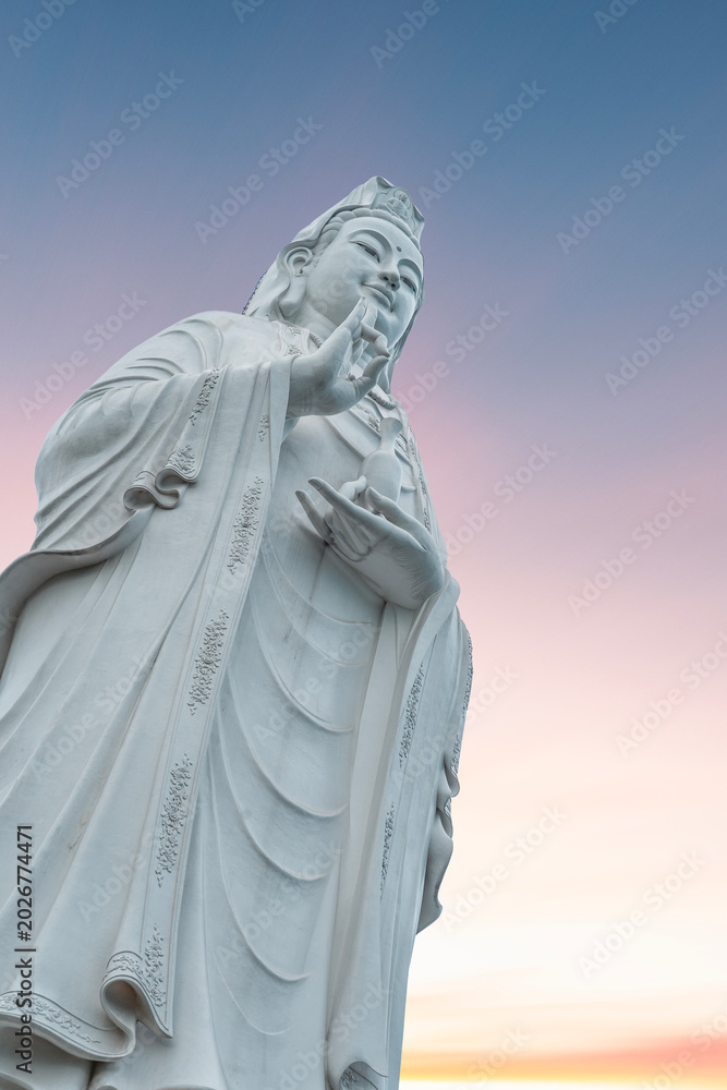 Fototapeta premium Lady Buddha statue on the sunrise. Danang Vietnam.
