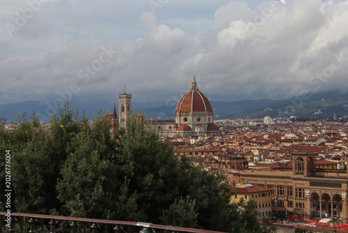 Slika na platnu Florence cityscape with Duomo and Bargello tower, Arno river reflecting warm sun