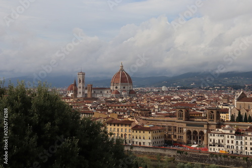 Fotografija Florence cityscape with Duomo and Bargello tower, Arno river reflecting warm sun