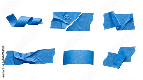 Fotografie Various blue masking tape pieces, including rolled, torn, and folded forms