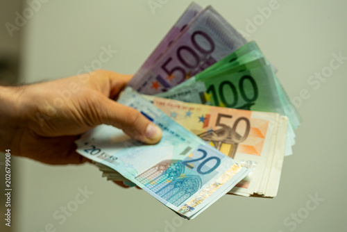 A hand displays a spread of...