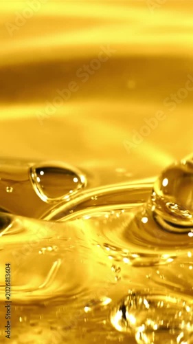 Olive oil pours with splashes. The texture of olive oil. Filmed on a high-speed camera at 1000 fps. 