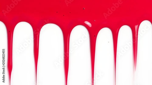 Red paint dripping vertically down a white background in a continuous sequence closeup abstraction of glossy liquid streaks elongating and merging, minimal modern texture and motion.