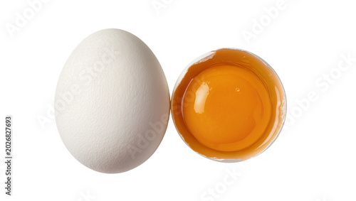 Billede på lærred Whole white egg and cracked egg with bright orange yolk, isolated on transparent