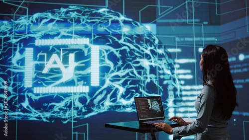 AI computer scientist using laptop for business data analysis in high tech workspace
